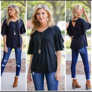 Vneck black shirt with flutter flutter sleeves.